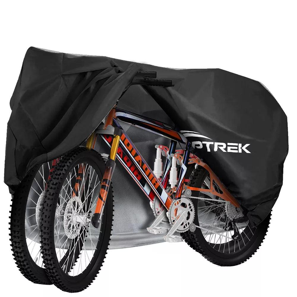 A partially covered mountain bike with its wheels and vibrant frame exposed is shielded by the Toptrek Bike Cover Waterproof, which prominently displays the brand name.