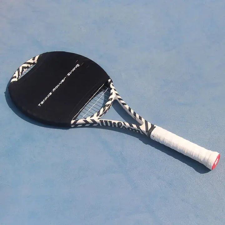 On a light blue court rests a Tennis Power Swing Racket, complete with a zebra-patterned design, boasting a black cover and white handle, crafted specifically for players aiming to enhance their strength training.