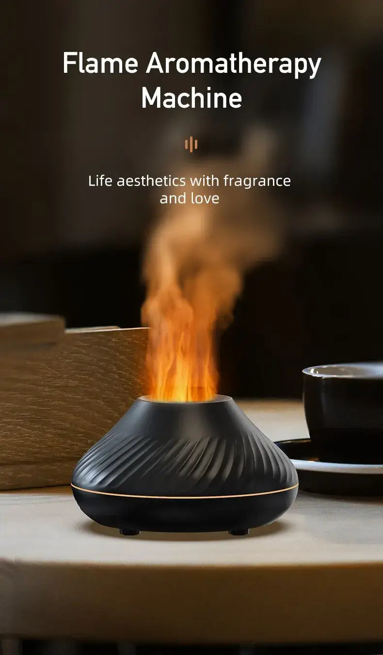 Black flame aromatherapy humidifier on table, emitting orange mist, ideal for small spaces with quiet operation and space-saving design.