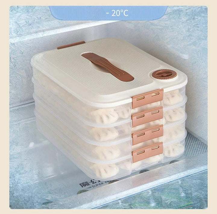 Neatly placed inside a freezer, the Food Storage Container for Fridge with its stackable, transparent design and brown clasps securely stores round pastries. The container ensures airtight sealing to preserve freshness even at -20°C.