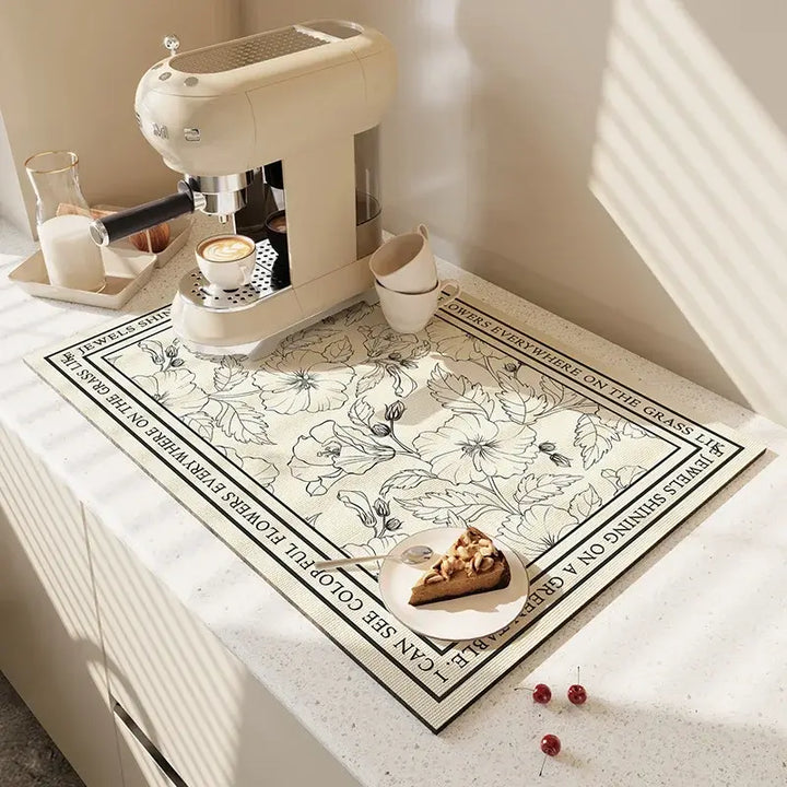 Modern kitchen mat with floral design under coffee machine on countertop, perfect for quick drying and antiskid features.