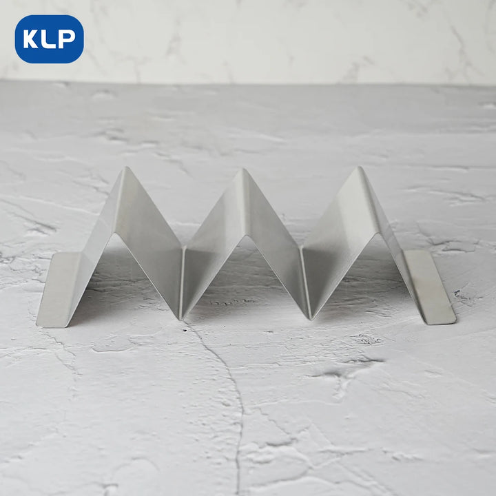 KLP 4pcs stainless steel taco holder with V-shaped design for upright tacos and hot dogs on a textured surface.