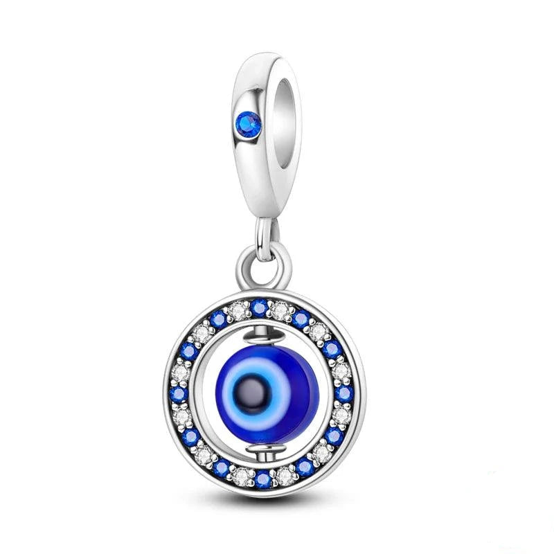 Discover the Pandora Compatible Charms, crafted from 925 sterling silver and designed for bracelet enthusiasts. This charm features a blue-and-white evil eye design accented with sparkling zircon gemstones. The pendant is elegantly encircled by small blue and white gems, and it hangs from a silver bail adorned with a single blue gemstone. Ideal for DIY jewelry makers aiming to create unique pieces.