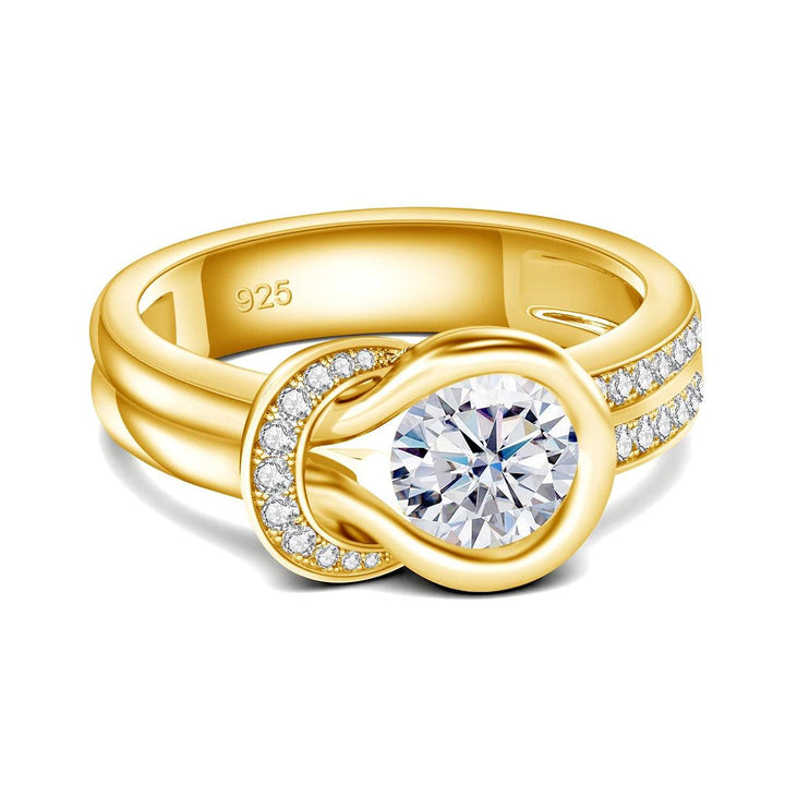 The Moissanite Engagement Ring from our collection showcases a captivating large round moissanite stone at its center, accented by intricately set smaller moissanites along the bow knot wedding band. Marked "925" on the inner side, it highlights its sterling silver foundation with a sophisticated gold overlay.