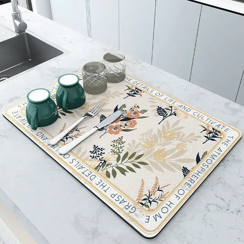 Floral kitchen mat made of diatom mud on countertop with dishes and glasses, showcasing modern style and eco-friendly design.