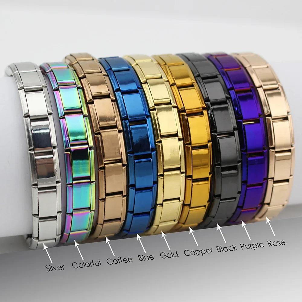 A collection of Hapiship Jewelry 9mm Width Italian Elastic Charm Bracelets showcasing vibrant shades like silver, colorful, coffee, blue, gold, copper, black, purple, and rose. Each bracelet is meticulously crafted with stainless steel and features a hidden-safety-clasp along with a glossy segmented design prominently displaying its respective color.