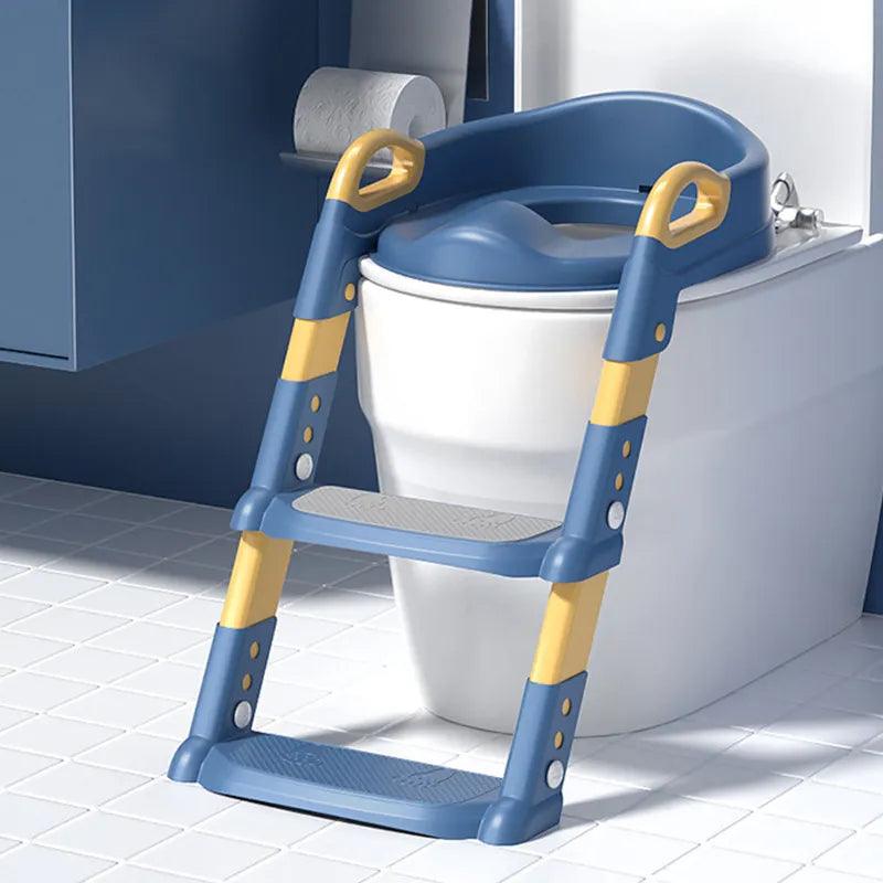 A "Children's toilet stool" from the "Baby toilet training" range, featuring a foldable design, is set up on the toilet. The vibrant blue and yellow color scheme helps kids use the bathroom independently, complementing the white tiled floor.