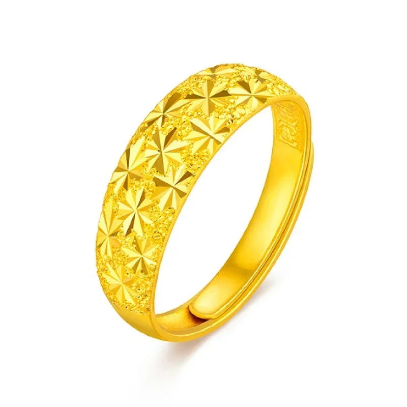 The Pure 999 Gold Ring, adorned with a textured starry design wrapping around its band, is beautifully showcased against a white background.