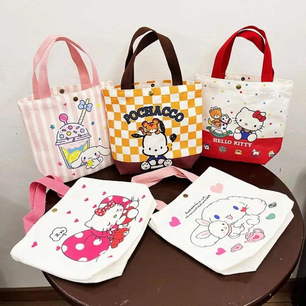 Five small My Melody canvas bags, designed as kawaii shoulder totes, are arranged on a round table. These anime-inspired bags feature durable canvas material with various Sanrio character designs like Hello Kitty and Pochacco. Each bag is adorned with patterns such as stripes, hearts, and checkered backgrounds in pastel and red tones.