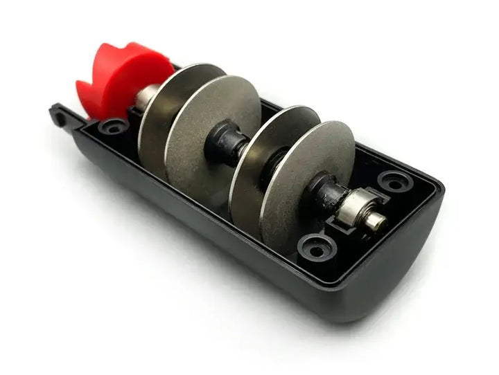 Electric knife sharpener with a red handle and metallic grinding wheels for efficient sharpening in the kitchen.