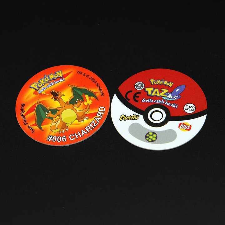 Included in the Pokemon Tazos Collection Tazos Collector's Edition for Generation 1/2 are two round collectible pieces. On the left, you'll find a Charizard design labeled "#006 CHARIZARD," accompanied by the Pokémon logo. The right one showcases a Pokéball design with Pokémon TAZ branding, and features Cheetos and Lay's logos on a vibrant red background—an ideal addition to any collector's album.