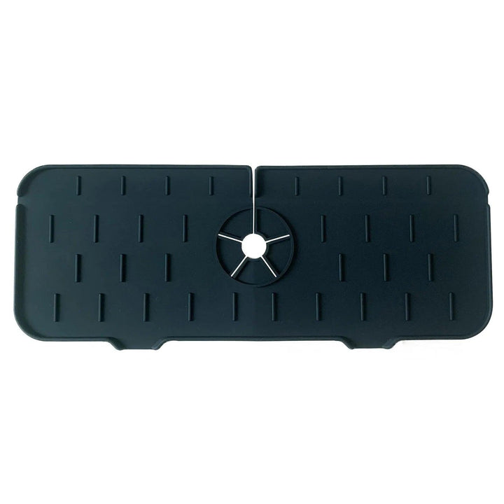 The Faucet Guard Kitchen Mat for Kitchen Sinks, a black rectangular silicone cover featuring a central circular opening and evenly spaced vertical ridges, provides an eco-friendly solution.