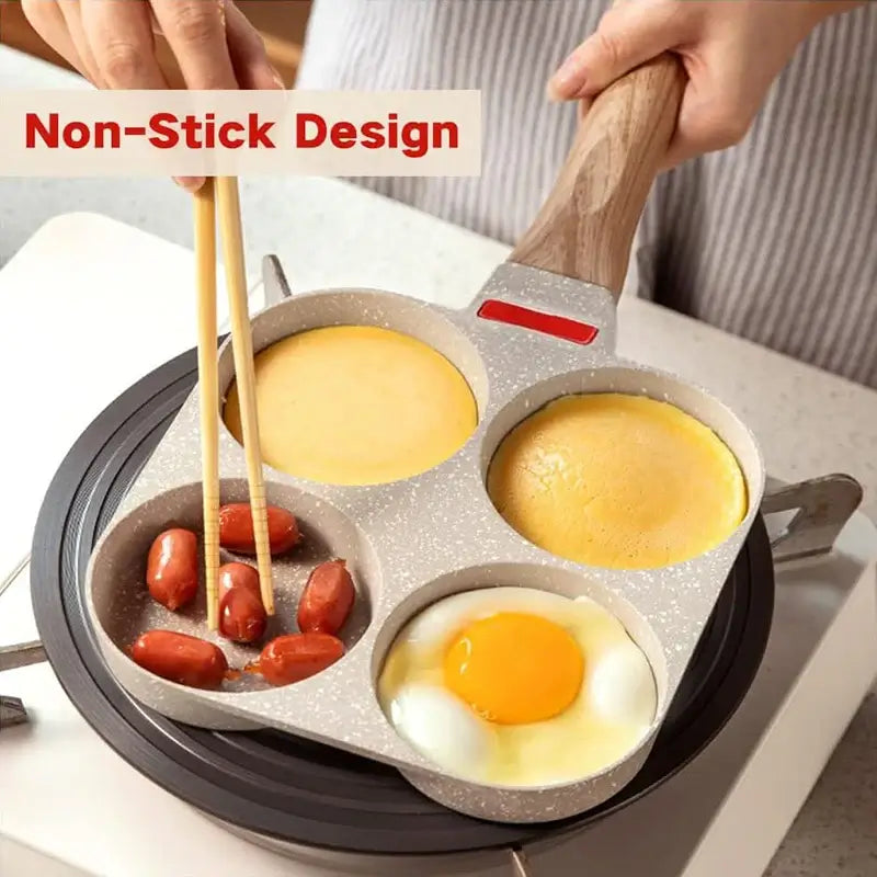 Egg frying pan with non-stick design cooking eggs, sausages, and pancakes on a stove top.