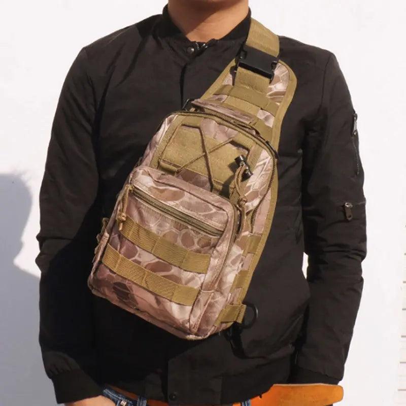 A person wearing a black jacket showcases a "Sling sport chest bag" in a camouflage pattern, featuring multiple compartments and adjustable straps. The tactical sling design of this "Shoulder crossbody bag" makes it ideal for outdoor activities. The background is plain white.