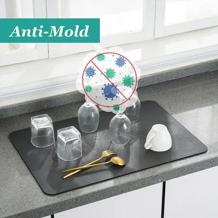 Anti-mold kitchen mat with diatom mud for quick drying and antiskid protection, perfect for dishes and utensils on countertops.