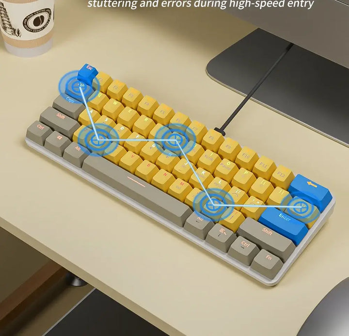 A sleek Gaming Wired Keyboard in yellow and gray rests on the desk, attached to a computer. Efficient key combinations are emphasized with blue symbols. Equipped with hot-swappable switches for personalization, it sits beside a cup adorned with a dollar sign, while a partially visible chair completes the setup.