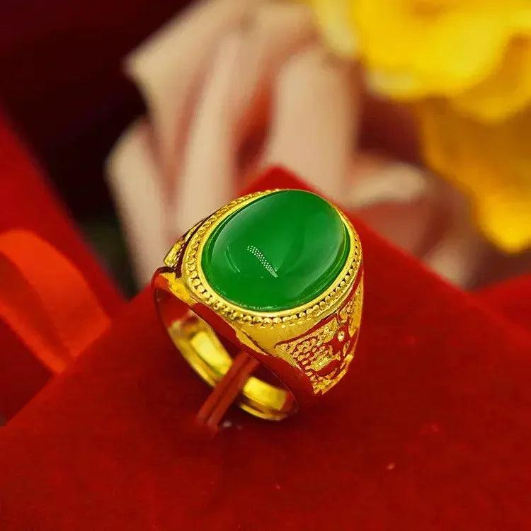 An exquisite piece, the Gold Ring 18K features an adjustable design with an intricate setting that highlights a large oval jade gemstone. It's elegantly presented on a red velvet background, enhanced by soft hints of yellow in the blurred backdrop.