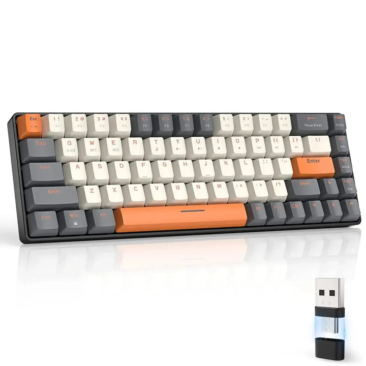 The Wireless Keyboard Bluetooth Dual Mode is a compact keyboard with tactile red switches, featuring keys in dark gray, ivory, and orange. The Enter and Spacebar keys are highlighted in orange for emphasis. For added convenience, it comes with a detachable USB receiver displayed in front of the keyboard.