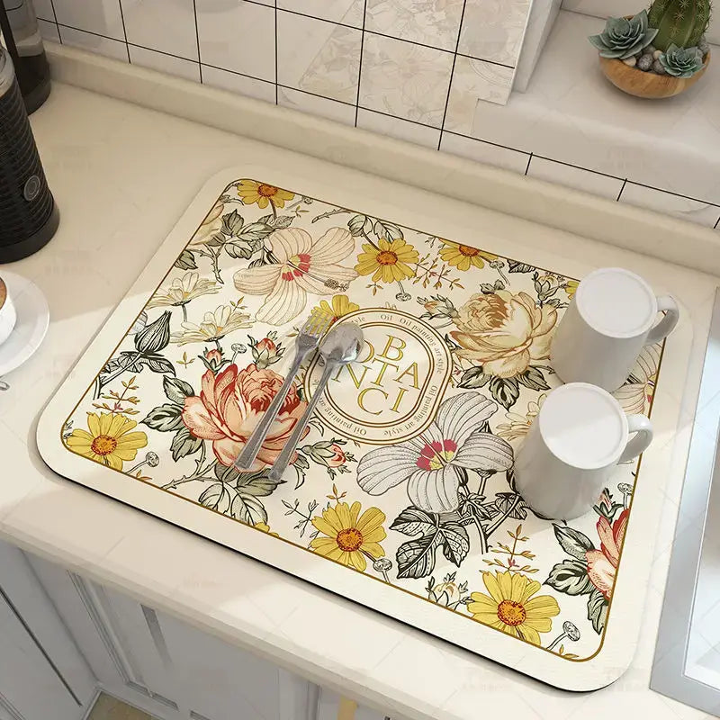 Floral kitchen mat with diatom mud material, featuring coffee mugs and cutlery, showcasing quick-dry and antiskid properties.