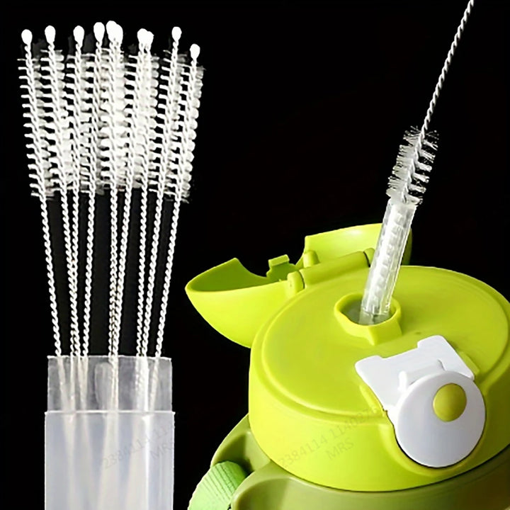 Beside a green bottle with a nozzle cleaner, you'll find a set of thin-bristled brushes from the "Baby Bottle Straws, Stainless Steel Brush, Hygienic Cleaning" collection. These brushes are perfect for eco-friendly cleaning and adeptly tackle narrow openings like baby bottle or stainless steel straws.