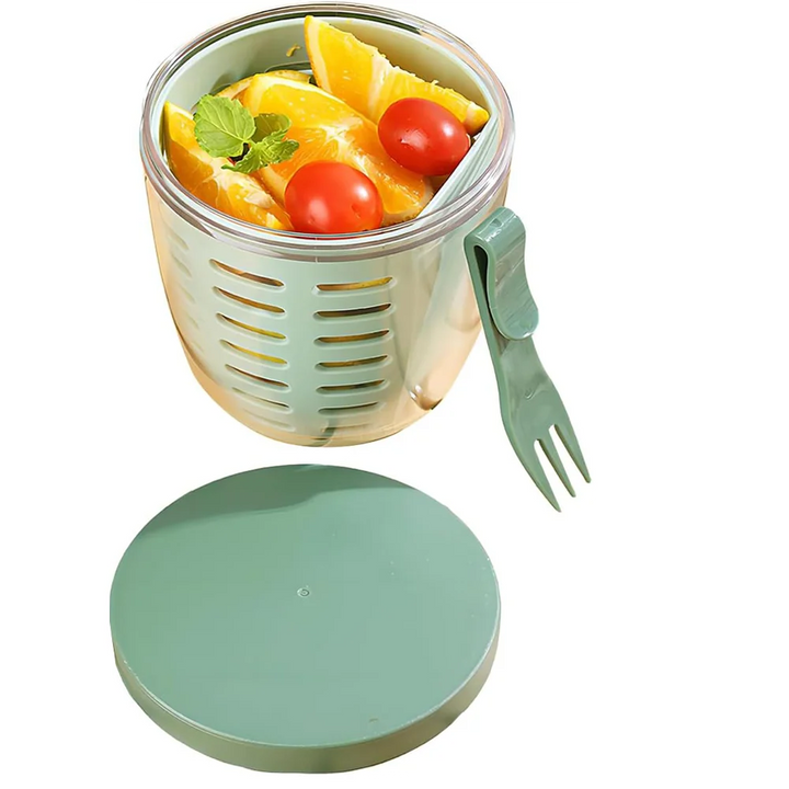 The Portable Fruit Cups with Lids and Fork, in eco-friendly mint-green with a gray lid and attached fork, are designed for holding fresh salad ingredients like orange slices, cherry tomatoes, and greens. With the lid conveniently placed beside the container, this Veggie Snack Pot is ideal for meal preparation and storing cereals, milk, vegetables, or fruit salads.