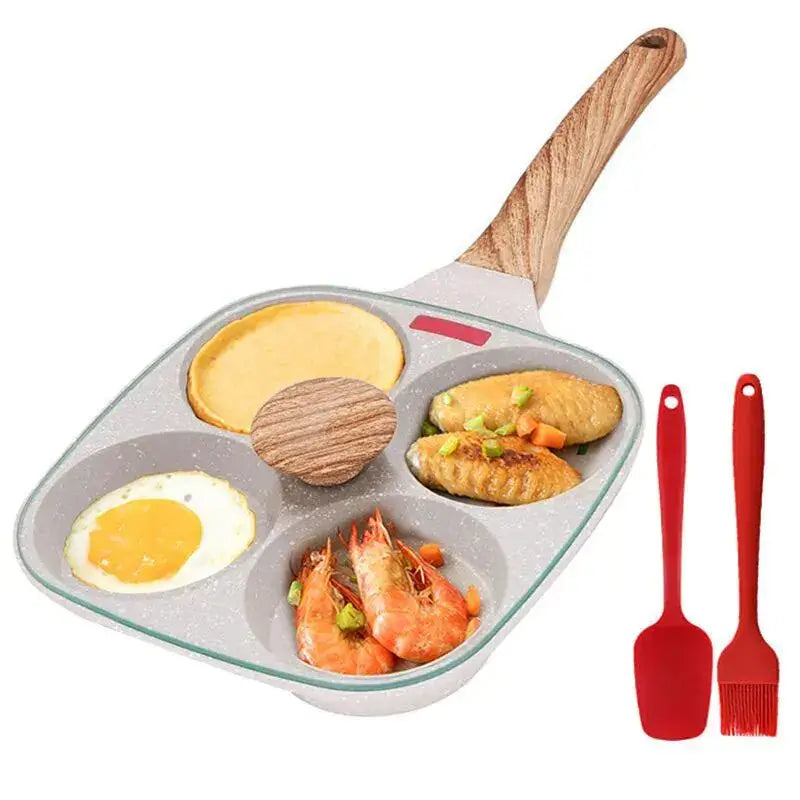 Non-stick egg frying pan with four sections for cooking eggs, shrimp, and pancakes, featuring wooden handle and red spatula.