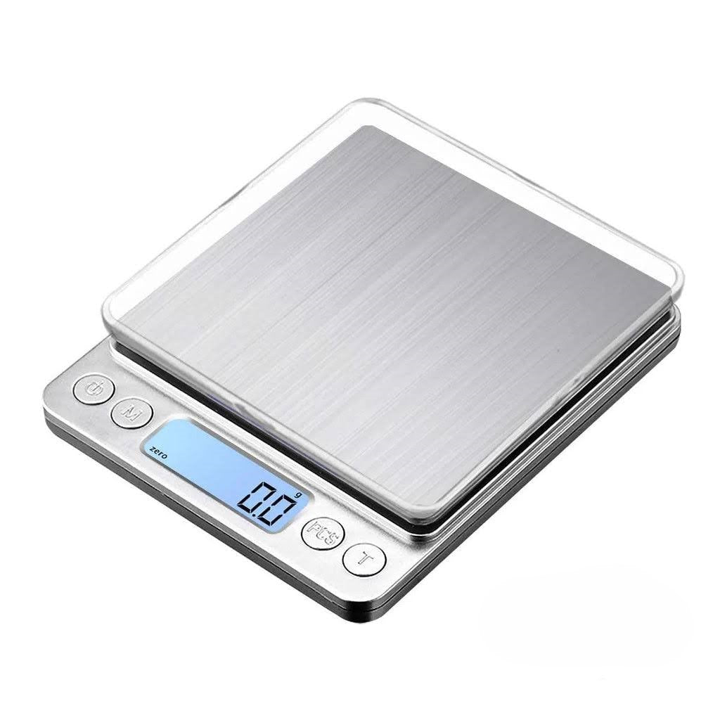 Introducing the Digital Jewelry Scale, Precision Food Scale, Portable Gram Scale: A versatile digital scale with a stainless steel surface and clear plastic cover. It functions as both a kitchen and jewelry scale, providing precise measurements as accurate as 0.2 grams on its blue-lit LED screen, with convenient buttons for power, tare, and mode selection.